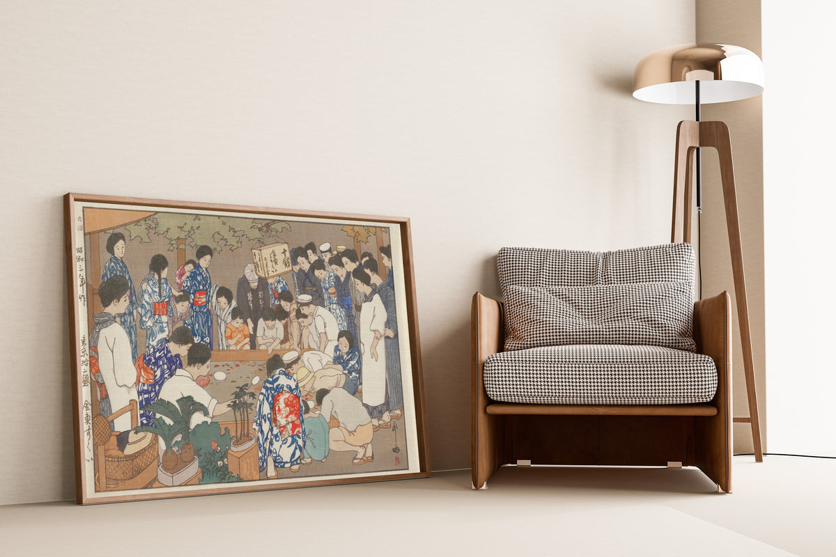 Framed art print of Dipping for Goldfish by Hiroshi Yoshida, leaning against a wall beside an armchair and a floor lamp