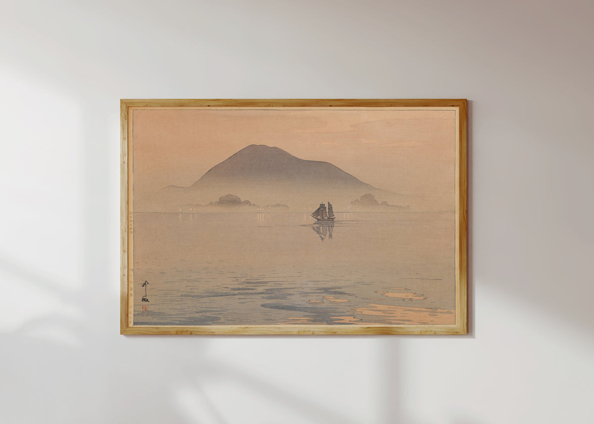Framed art print of Evening After Rain, Inland Sea by Hiroshi Yoshida, in a light wood frame on a sunlit white wall