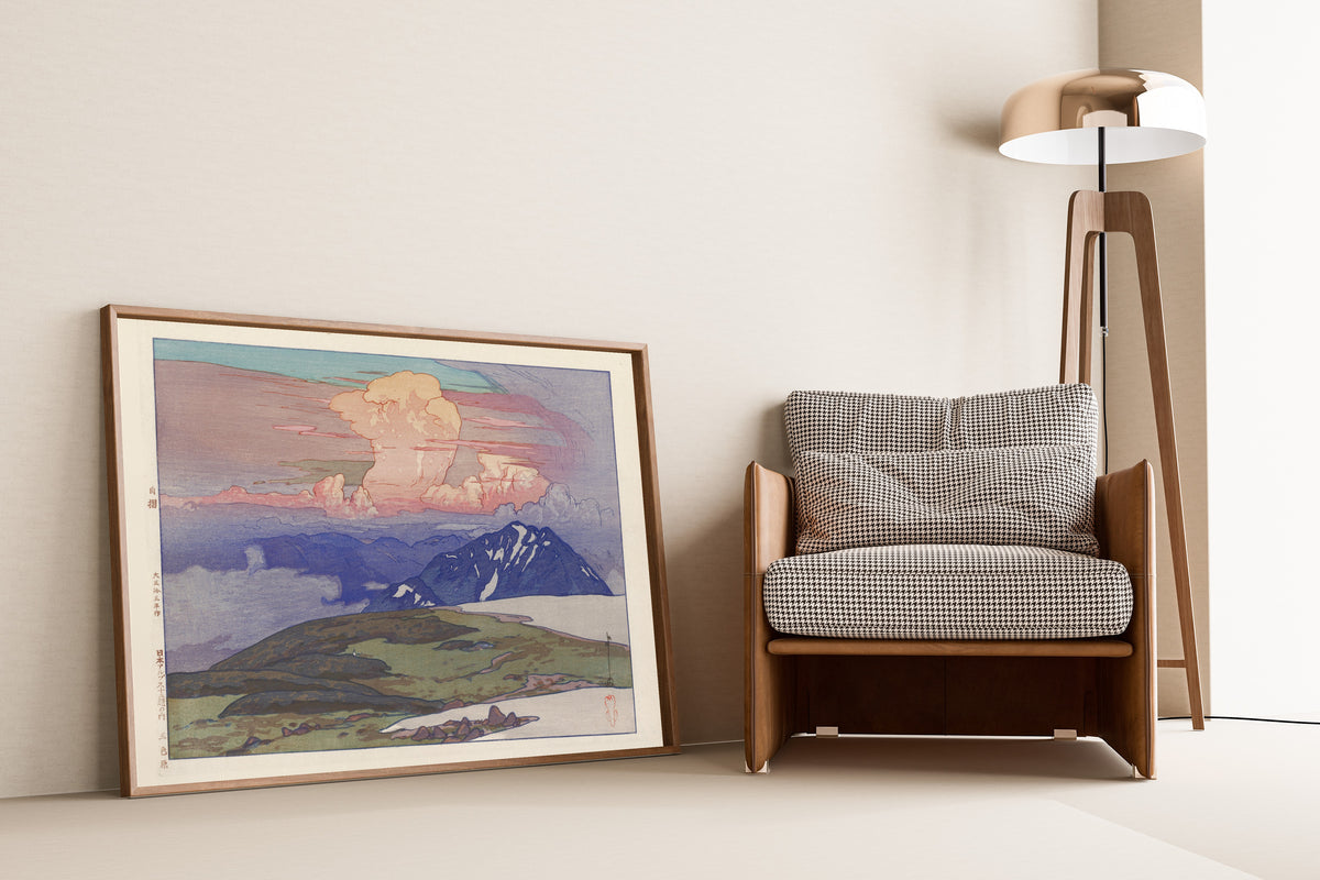 Framed art print of Goshikigahara by Hiroshi Yoshida, leaning against a wall beside an armchair and a floor lamp