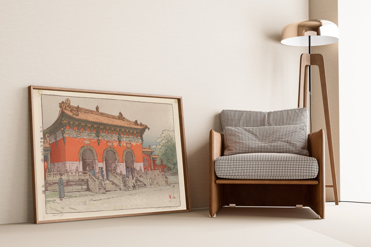 Framed art print of Hokuryo (North Tomb) by Hiroshi Yoshida, leaning against a wall beside an armchair and a floor lamp