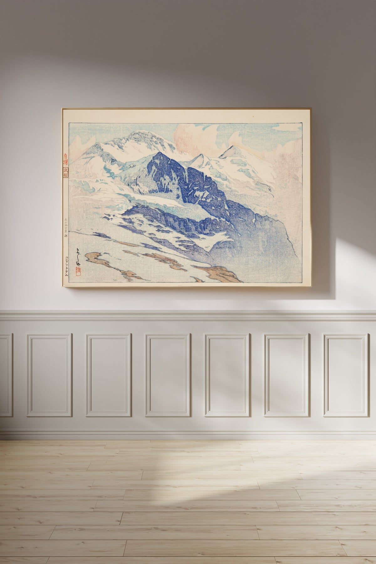 Framed art print of Jungfrau by Hiroshi Yoshida, on a panelled wall in afternoon light