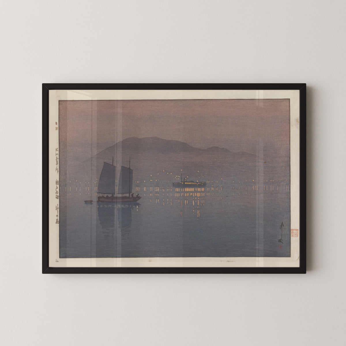 Framed art print of Kōnoshima by Hiroshi Yoshida, in a black frame on a pale wall