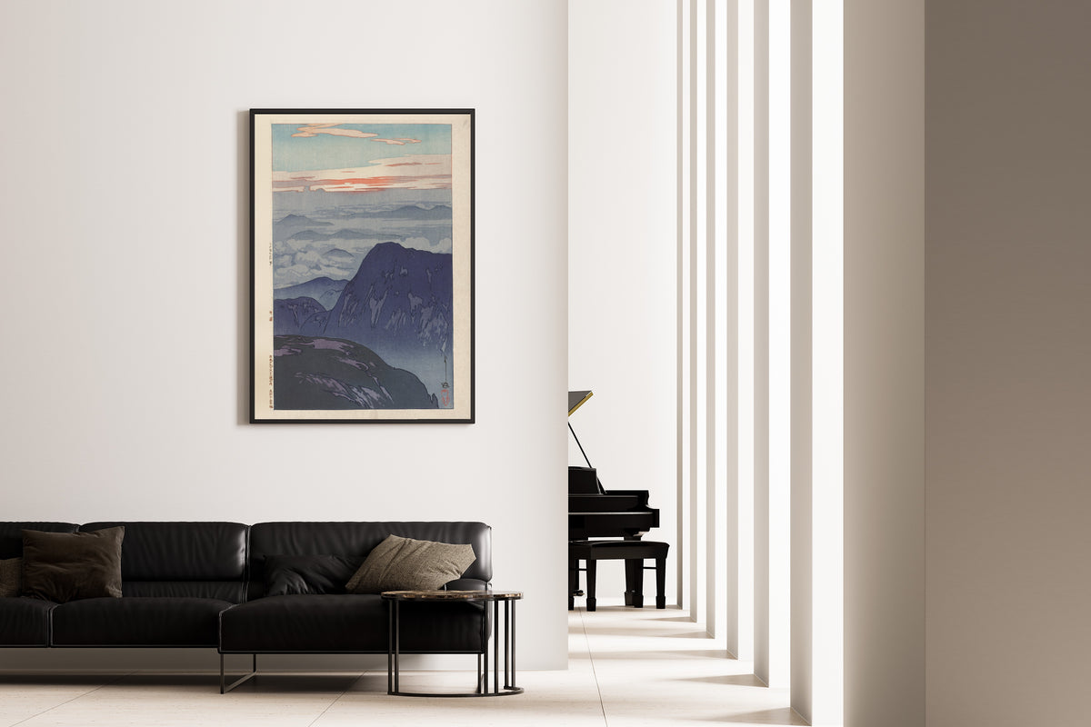 Framed art print of Sunrise on Eboshidake by Hiroshi Yoshida, on the wall of a minimal living room