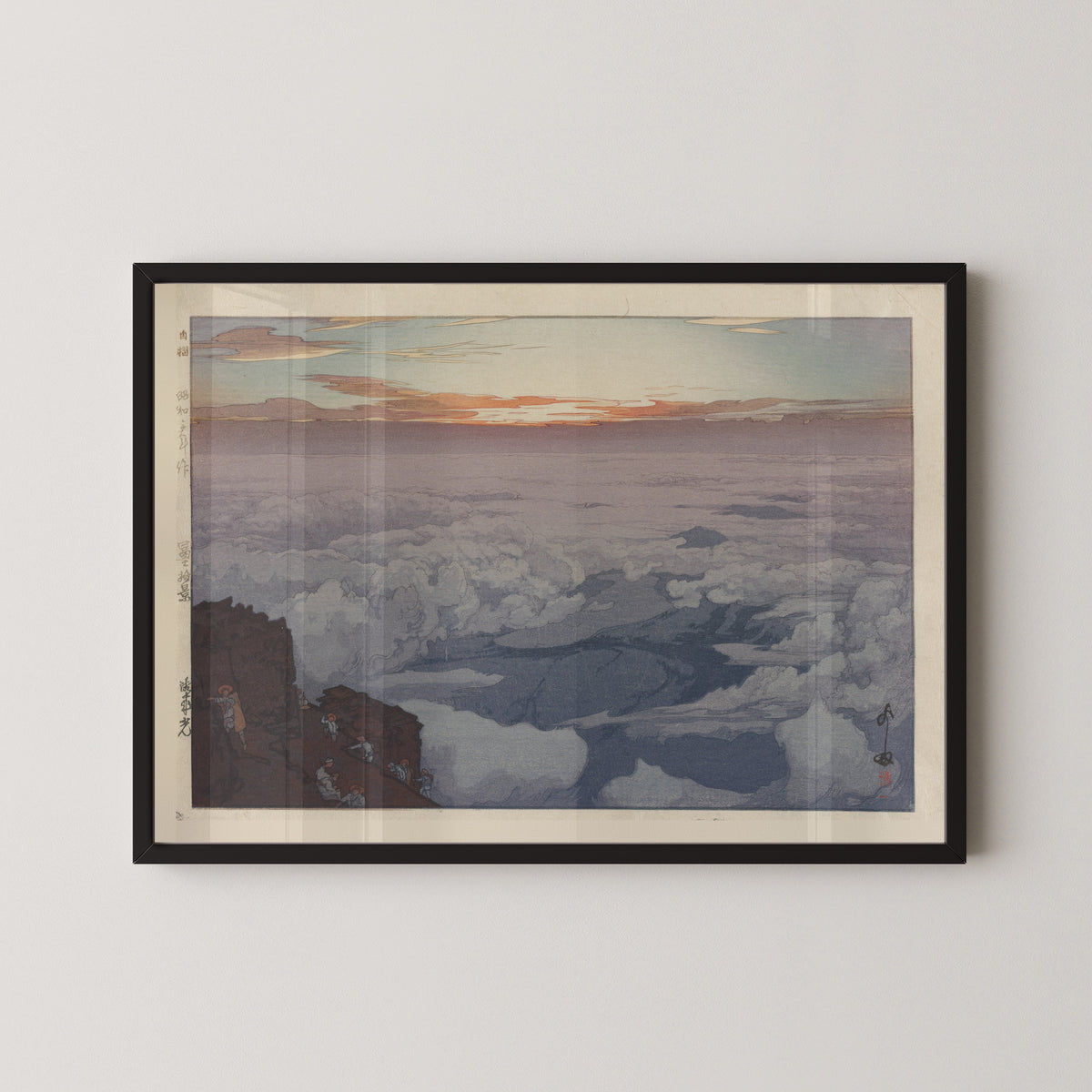 Framed art print of Sunrise Rite by Hiroshi Yoshida, in a black frame on a pale wall