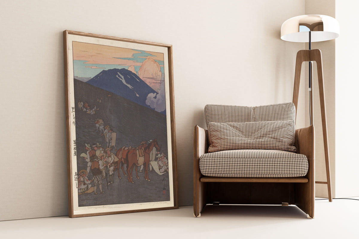 Framed art print of The Horse Turn-Back by Hiroshi Yoshida, leaning against a wall beside an armchair and a floor lamp