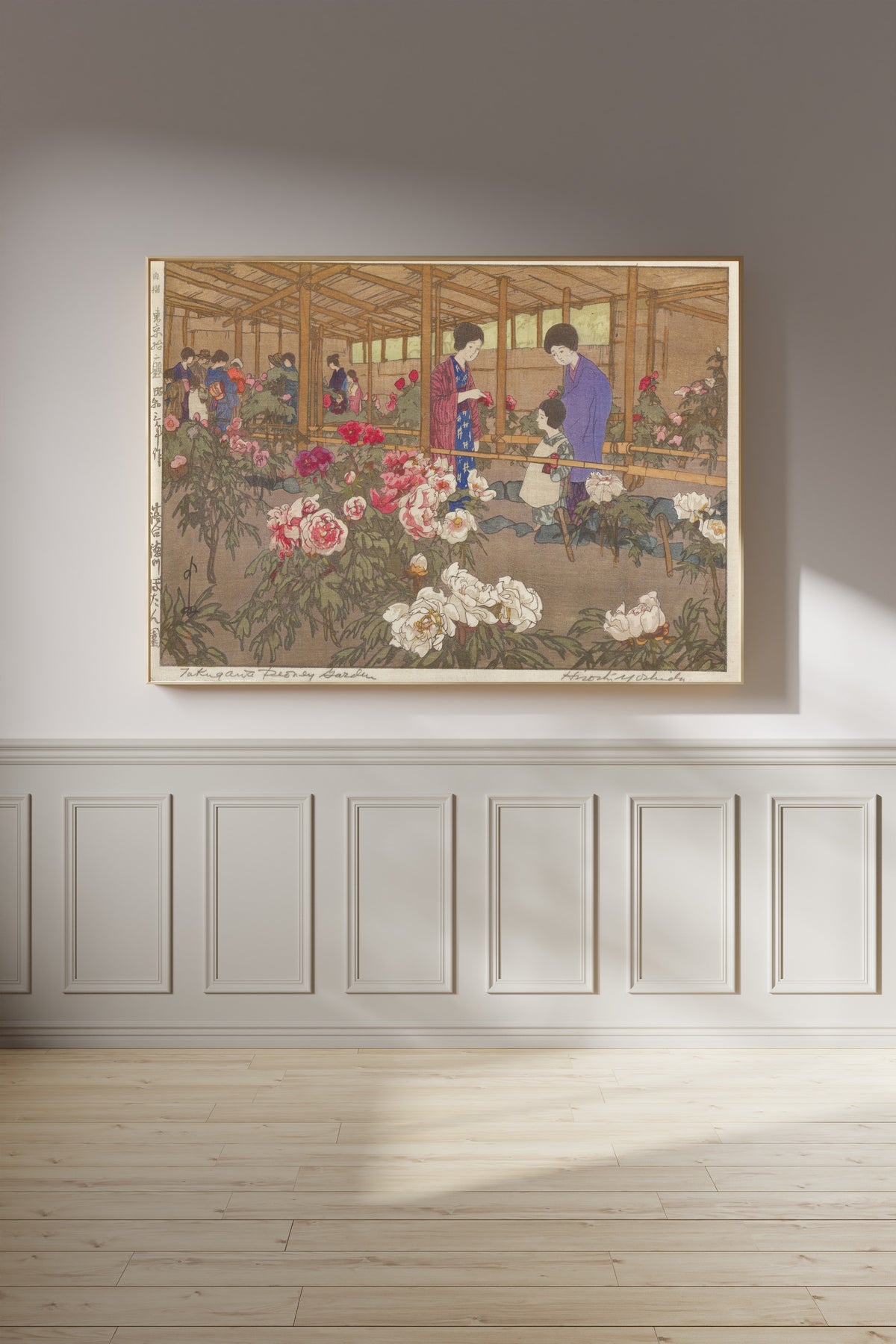 Framed art print of The Tokugawa Peony Garden at Ochiai by Hiroshi Yoshida, on a panelled wall in afternoon light