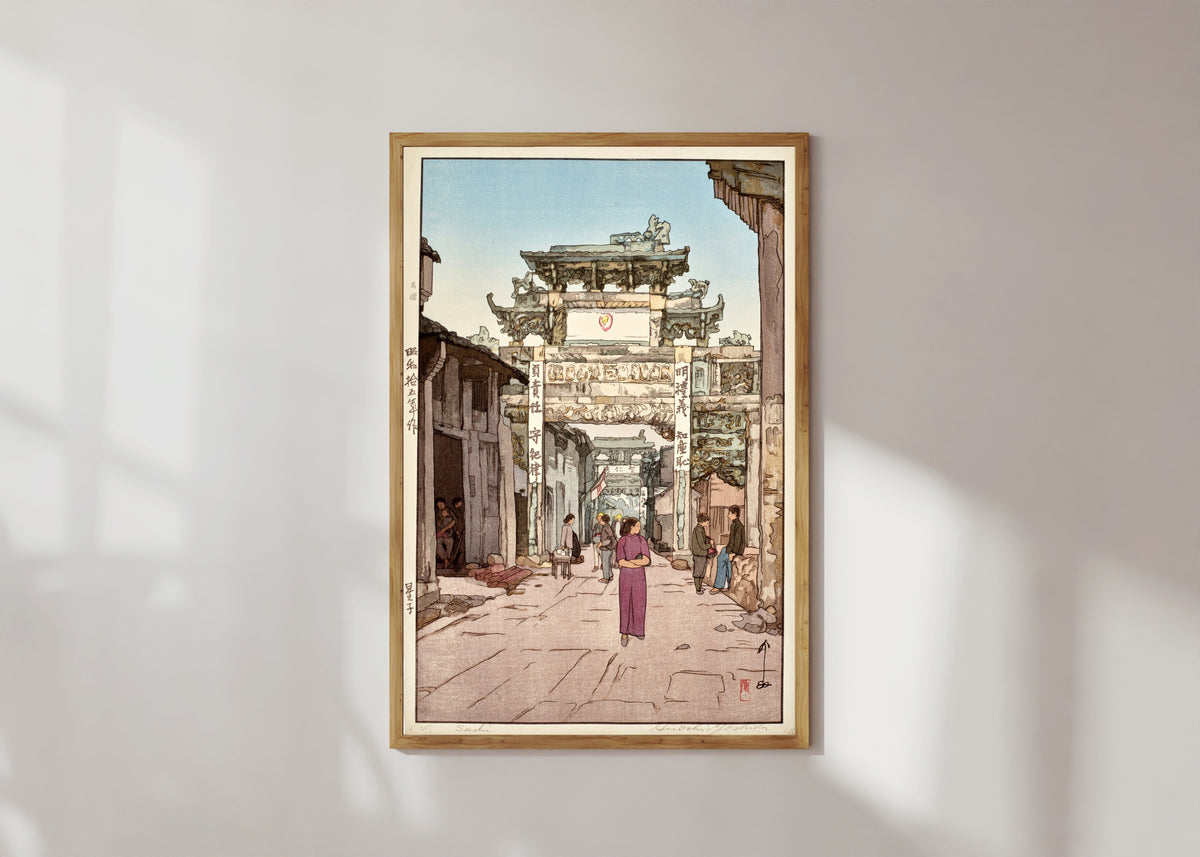Framed art print of Xingzi by Hiroshi Yoshida, in a light wood frame on a sunlit white wall