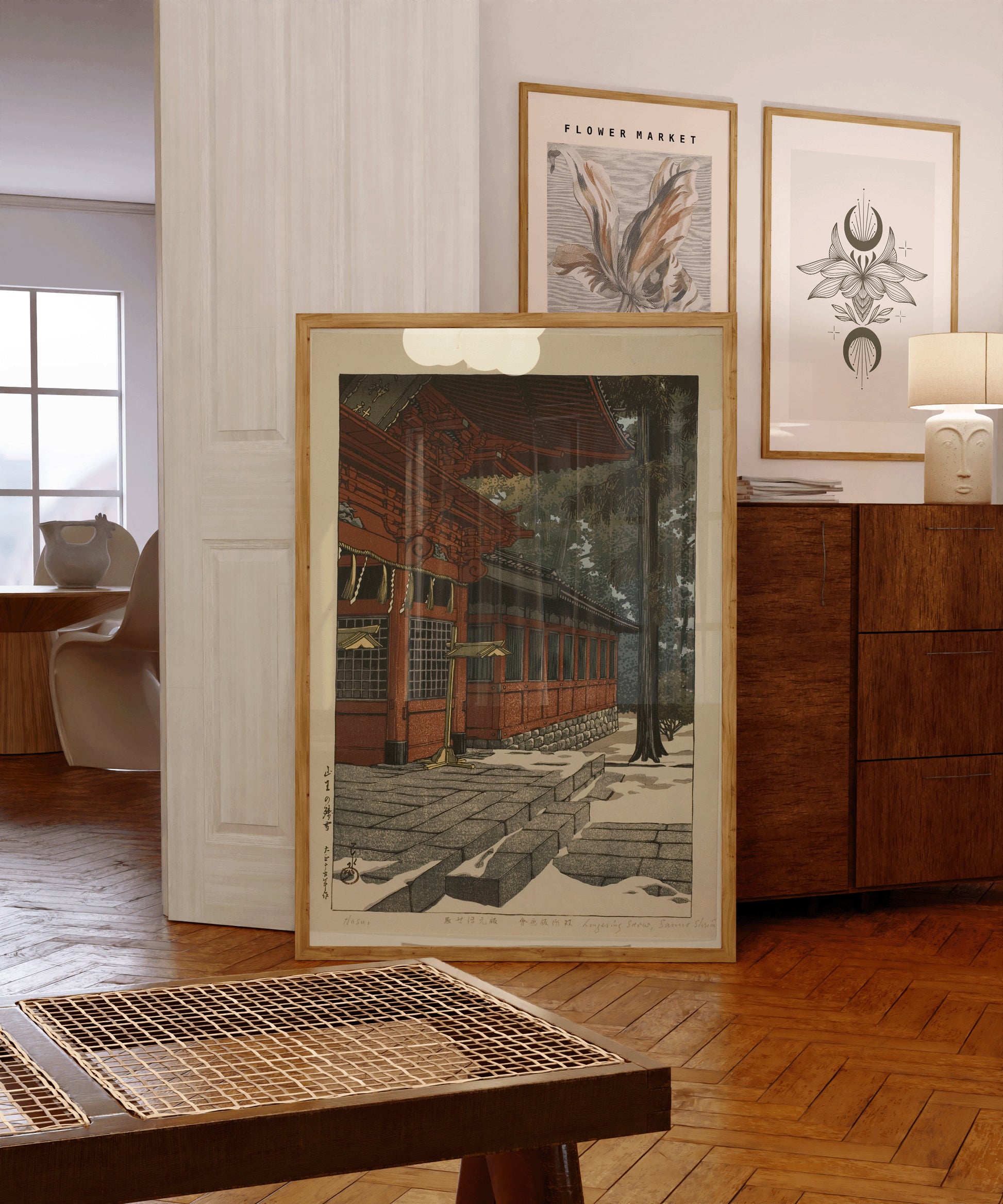 Kawase Hasui vintage framed woodblock art "Lingering Snow at Sanno" displayed in elegant interior space.