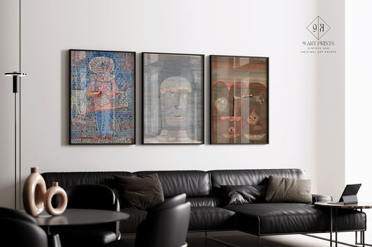 Paul Klee set of 3 vintage abstract art prints in elegant black frames displayed above a modern black leather sofa.