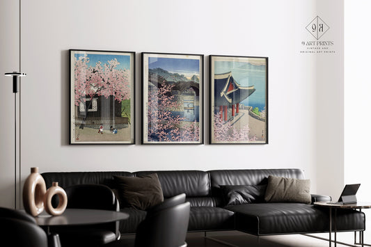 Kawase Hasui spring art prints set, framed, in modern living room showcasing Kintai Bridge, Mount Atago, and Pubyong Pavilion.