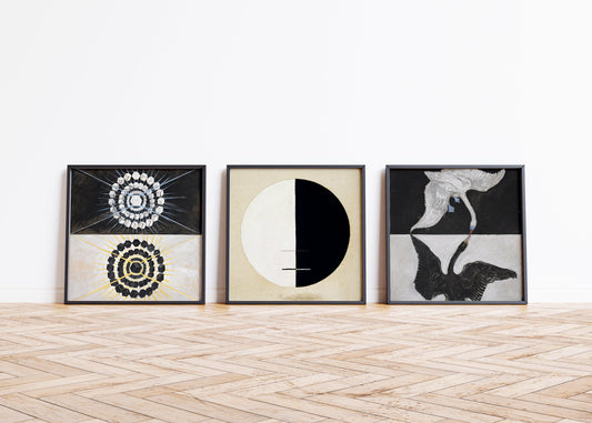 Hilma Af Klint set of 3 abstract vintage art prints, framed on wooden floor background.