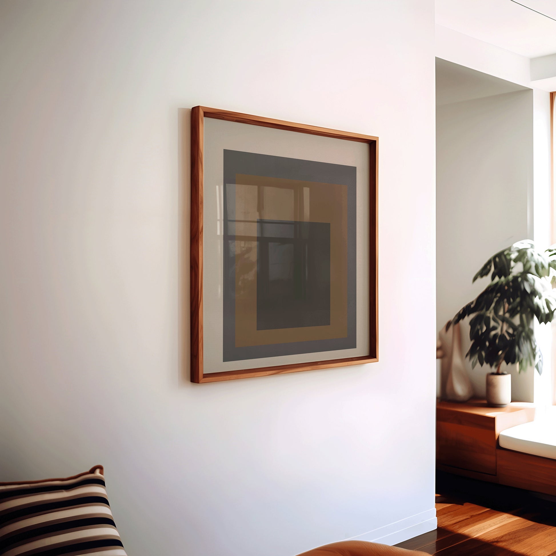 Mid-century modern art print in a bespoke wooden frame, hanging in a stylish living room, showcasing beige, black, and brown tones.