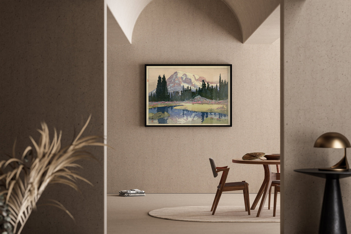 Vintage Japanese woodblock print of Mount Rainier framed on a modern living room wall with minimalistic decor.