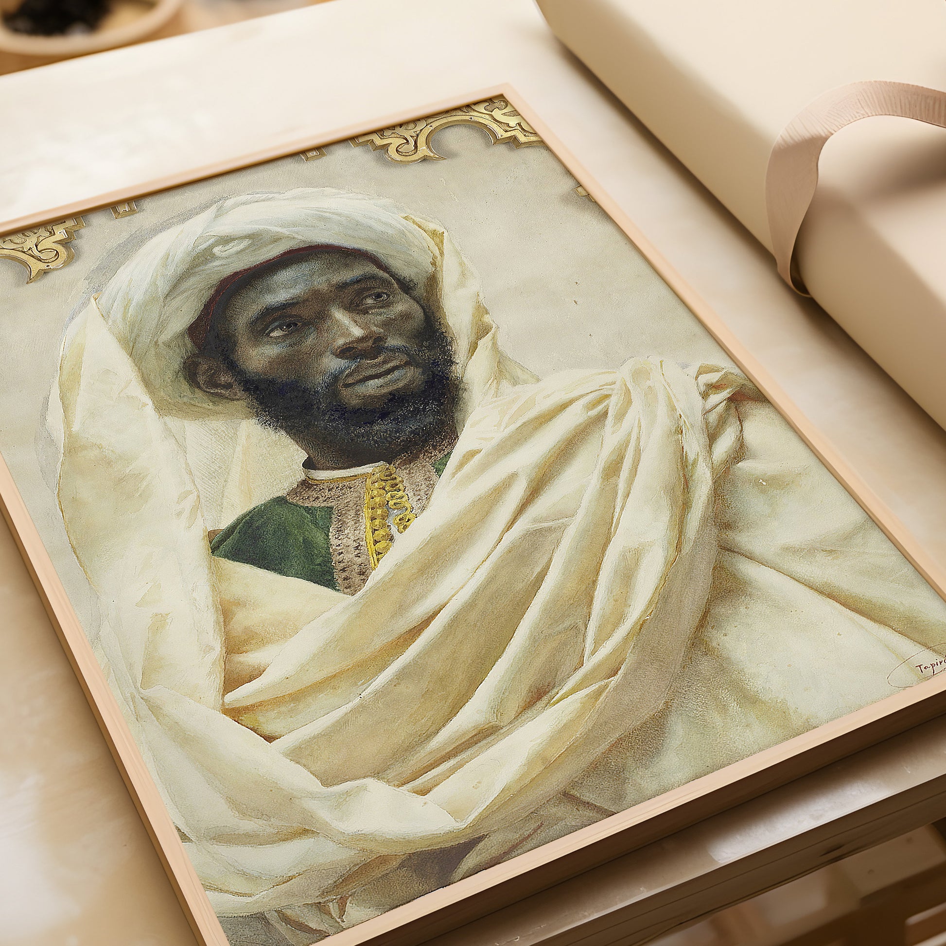 Vintage portrait of Moorish man by Josep Tapiró i Baró, framed fine art print on a table, available in museum-quality finish.