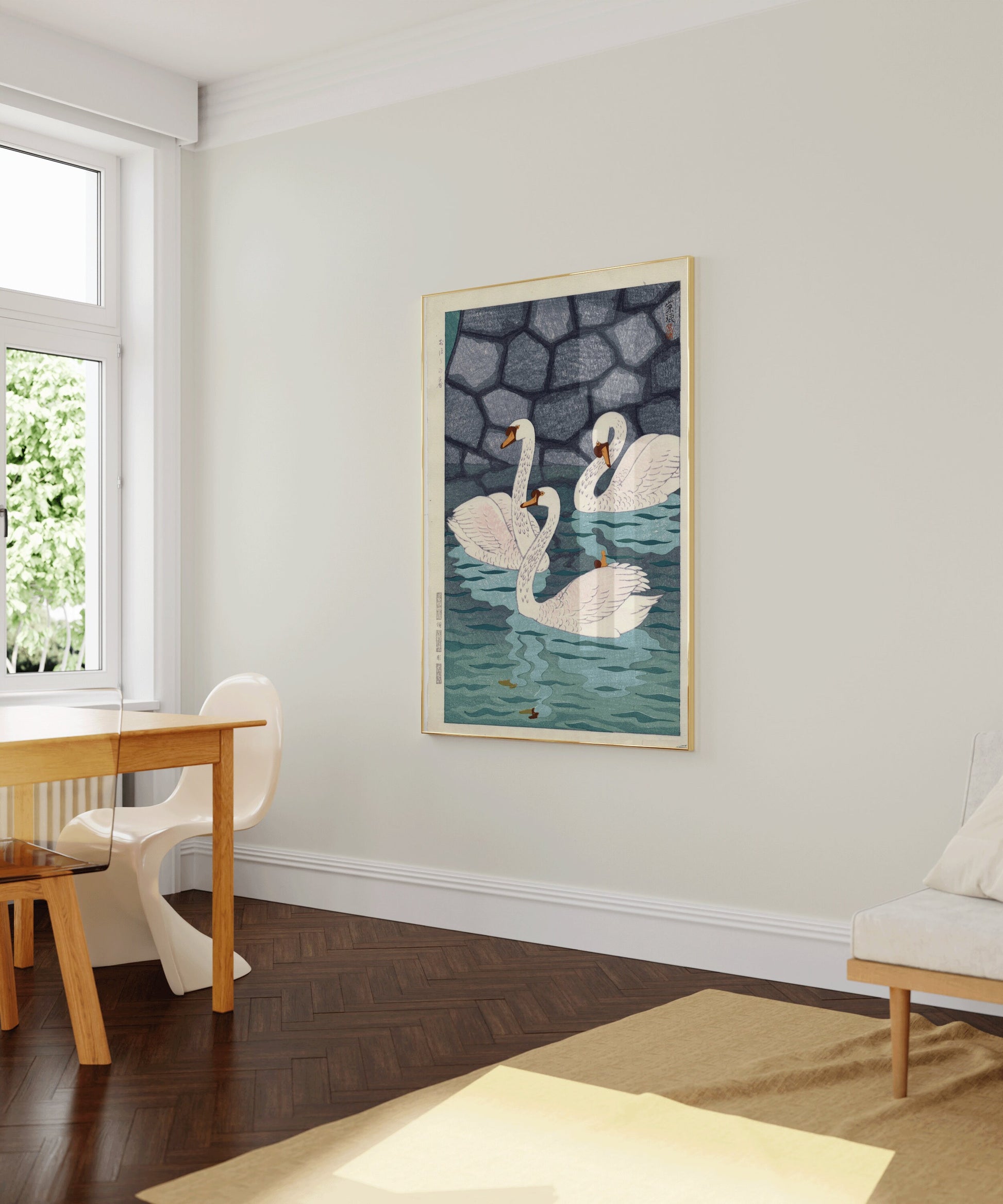 Framed Shiro Kasamatsu vintage Japanese woodblock print of swans, displayed in a modern room with natural sunlight.