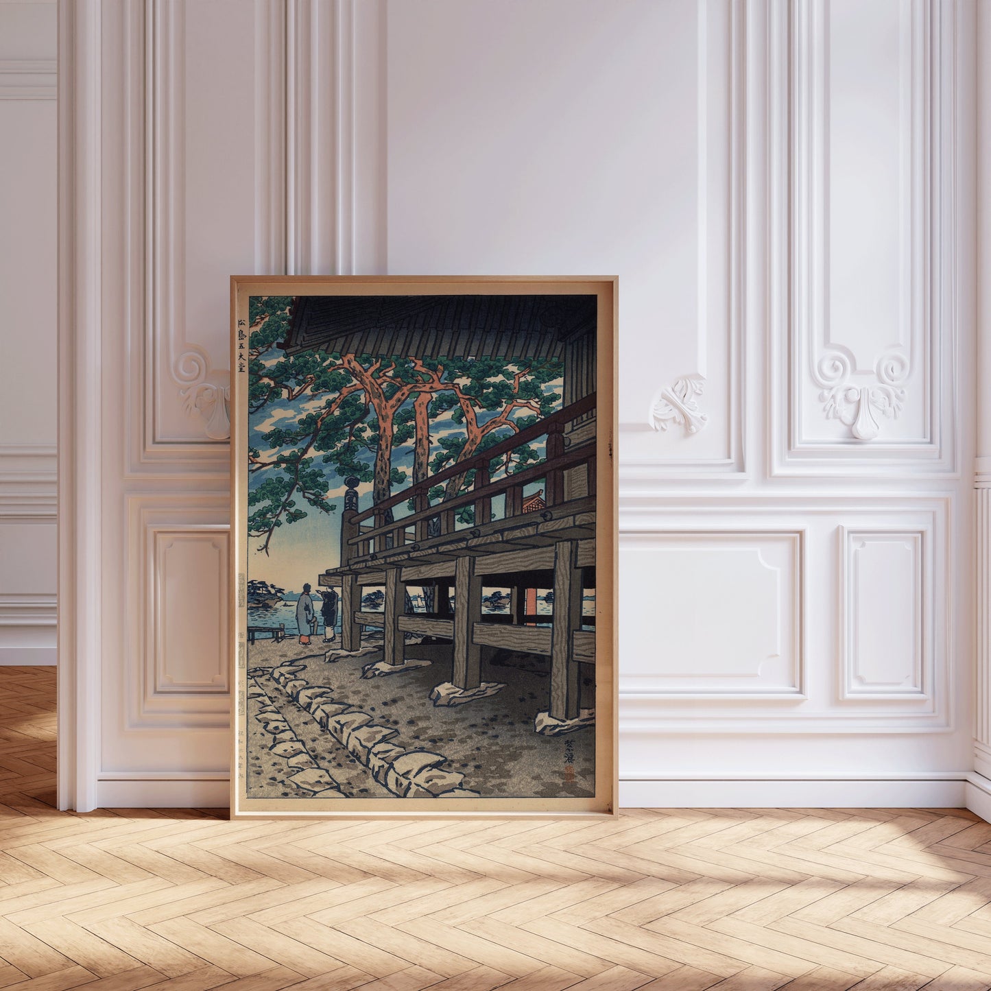 Vintage Japanese Shin-Hanga art of Godaido Pagoda framed in a nude oak, displayed in an elegant room with white walls.