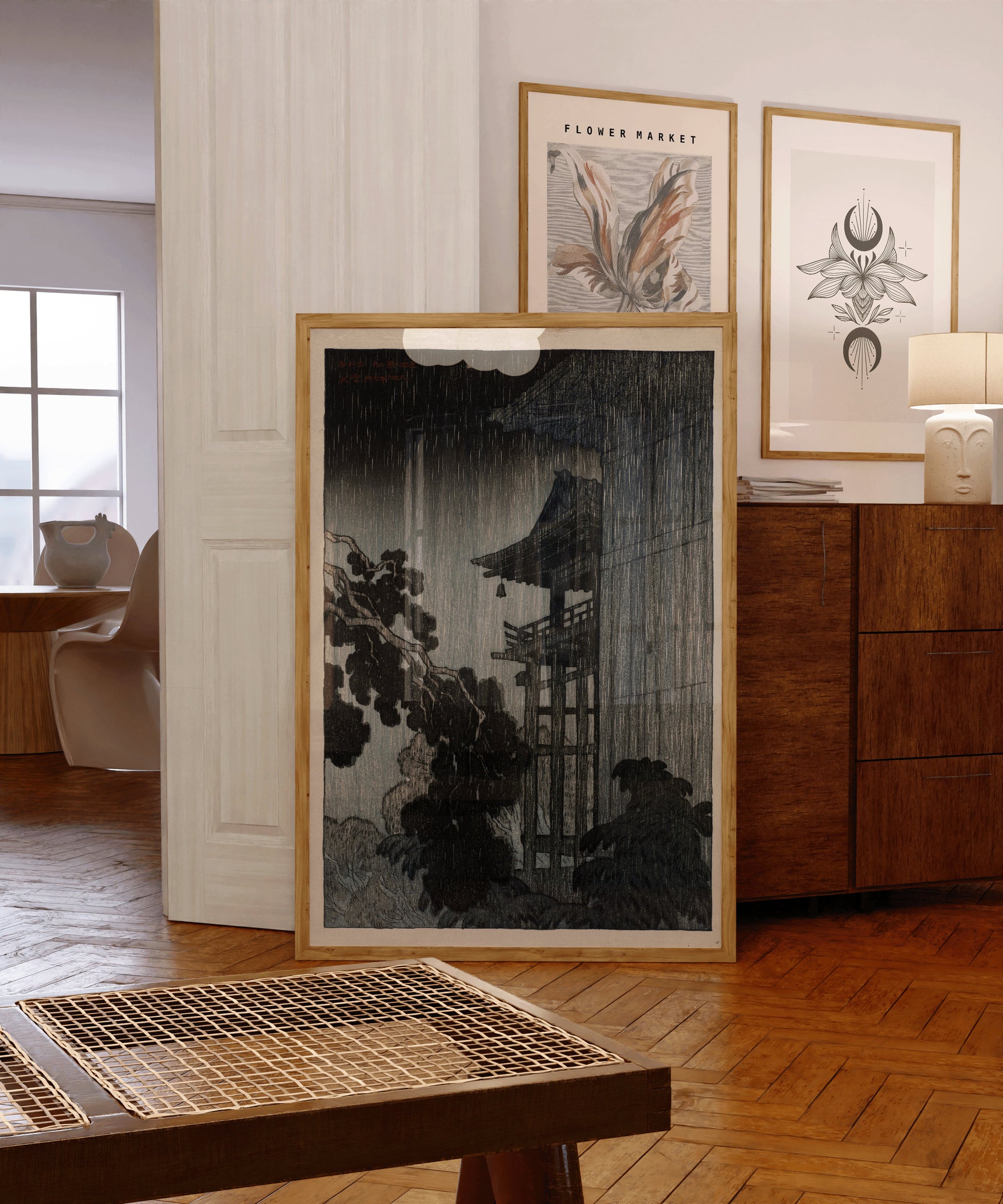 Vintage Japanese art print of Mi-i Temple in night rain, framed in Nude Oak, displayed in a stylish, modern interior setting.