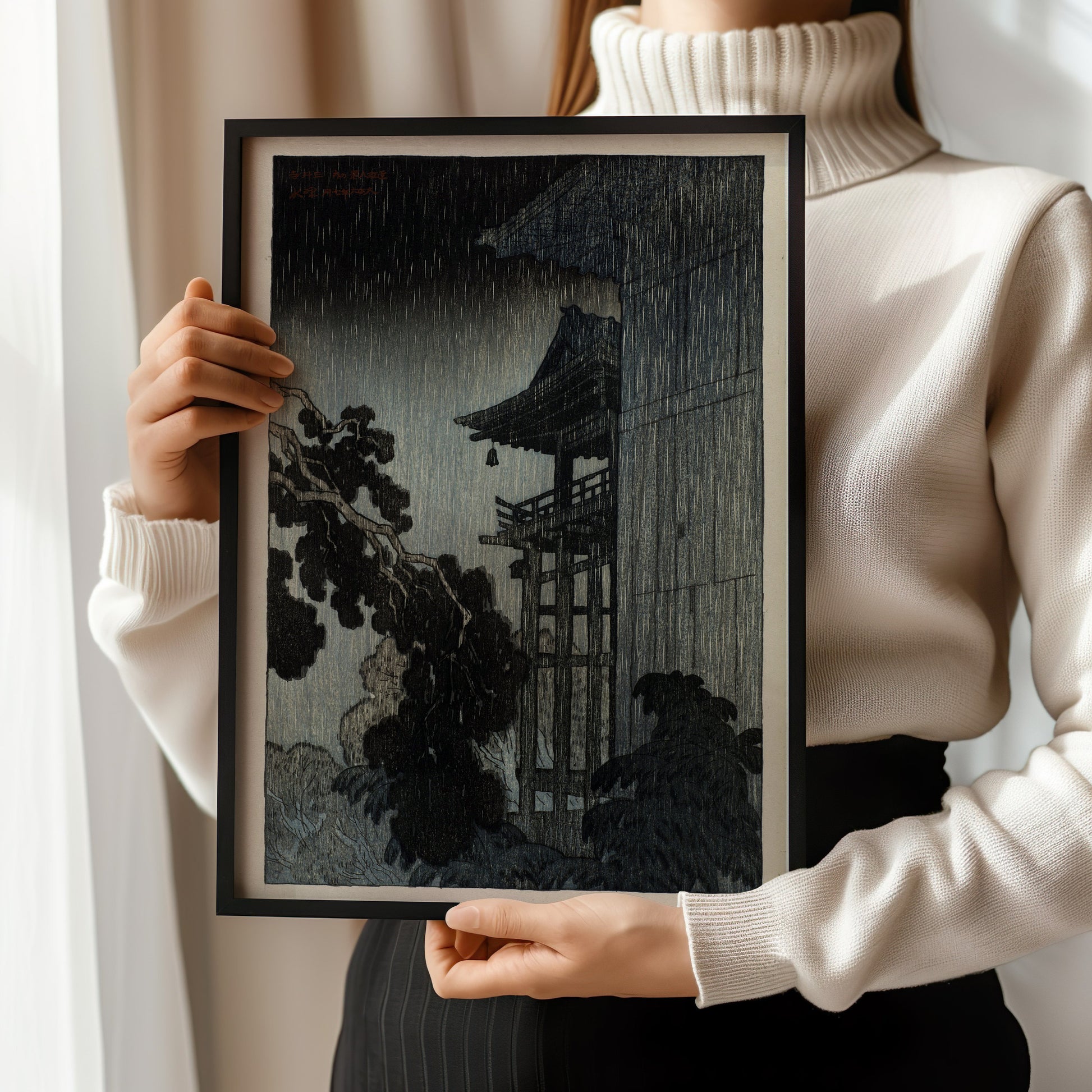 Person holding framed vintage Japanese Shin-Hanga art print of Mi-i Temple in the night rain.