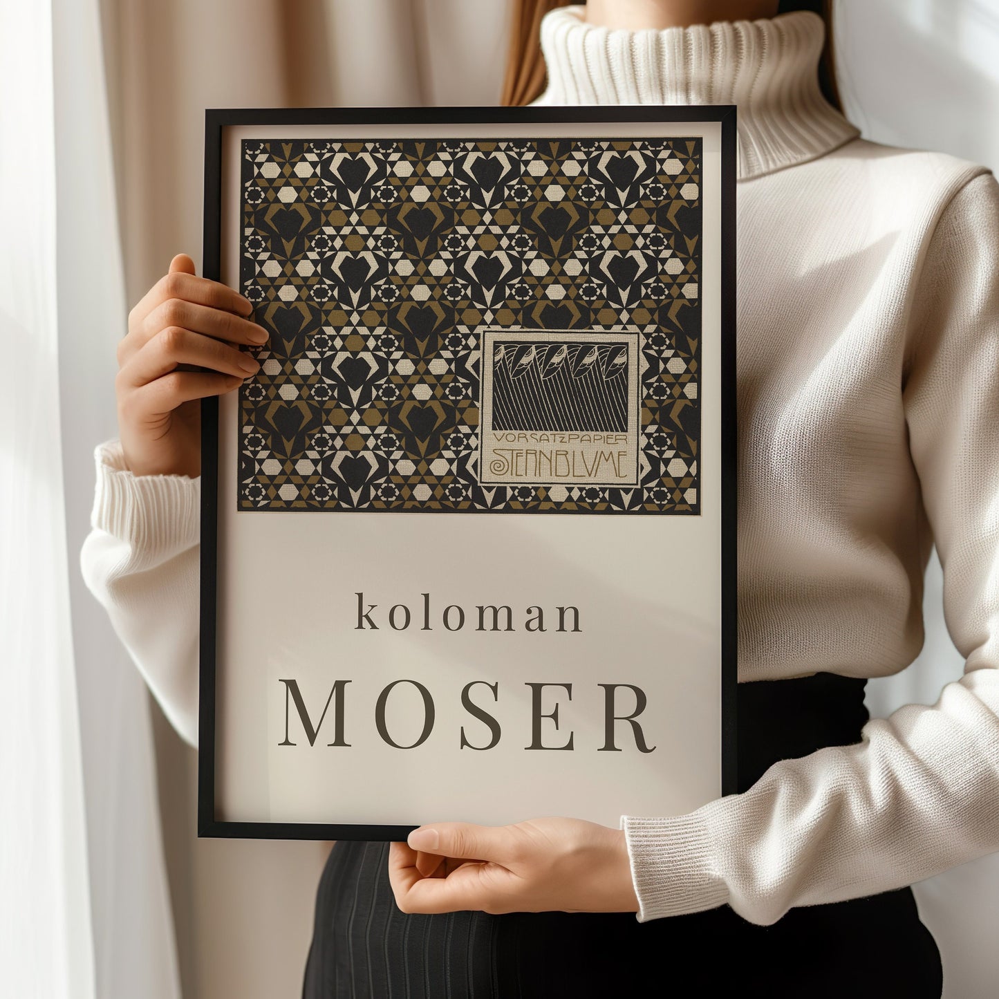 Person holding framed Koloman Moser Starflower Endpaper print, vintage exhibition poster, available framed or unframed.