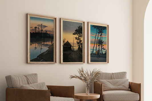 Kawase Hasui set of 3 dusk theme framed art prints on wall above cozy chairs in modern living room.