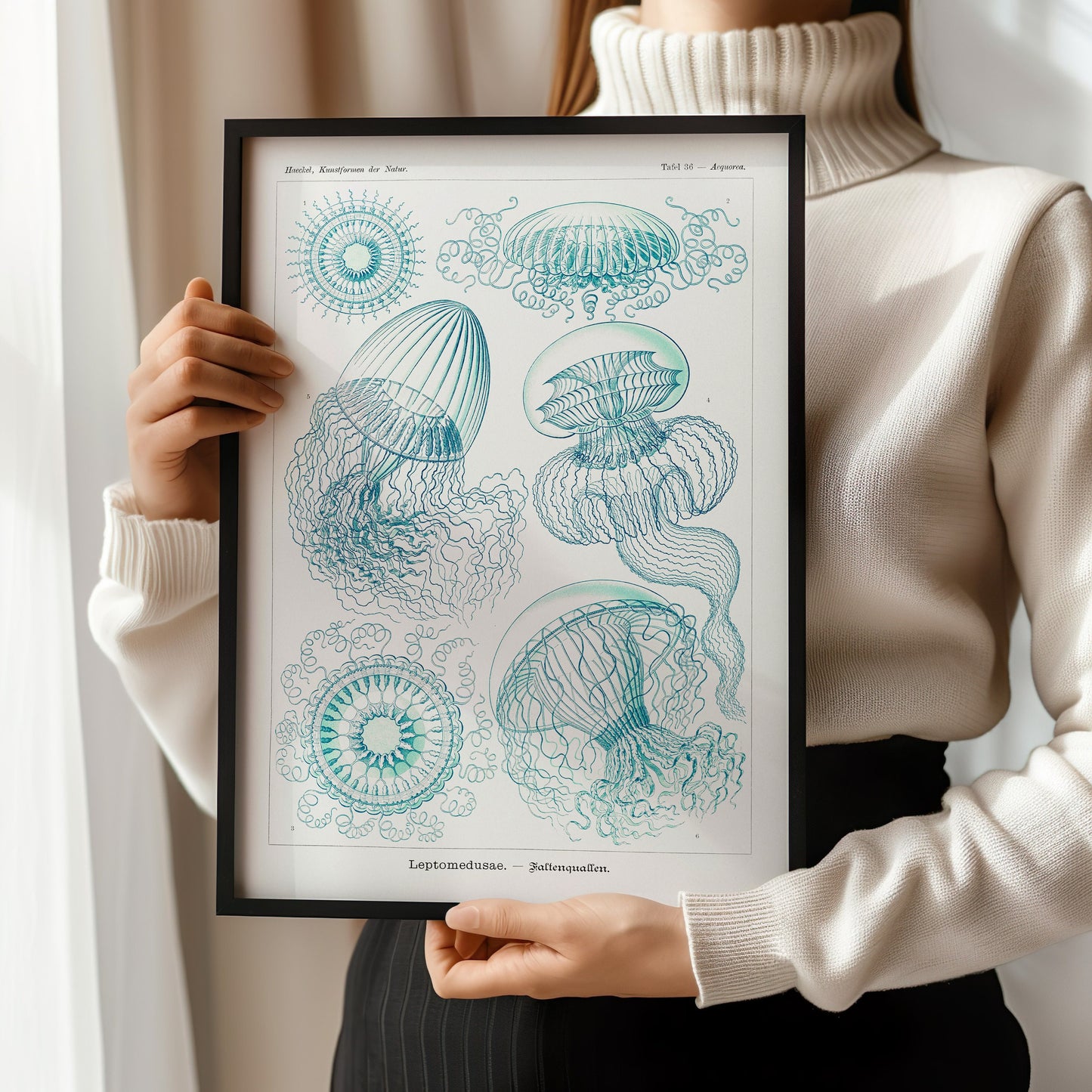 Woman holding framed Ernst Haeckl jellyfish art print in beige and blue, available in bespoke or classic frame options.