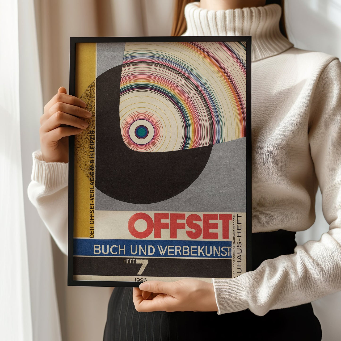 Woman holding framed Bauhaus Joost Schmidt Offset Magazine Cover art print, showcasing mid-century modern design.