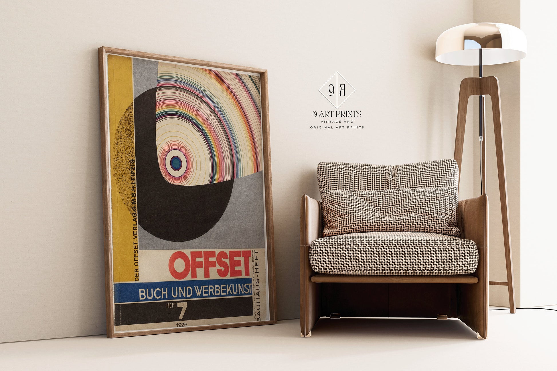 Bauhaus Joost Schmidt Offset magazine cover art print framed, next to modern chair and lamp in stylish living space.