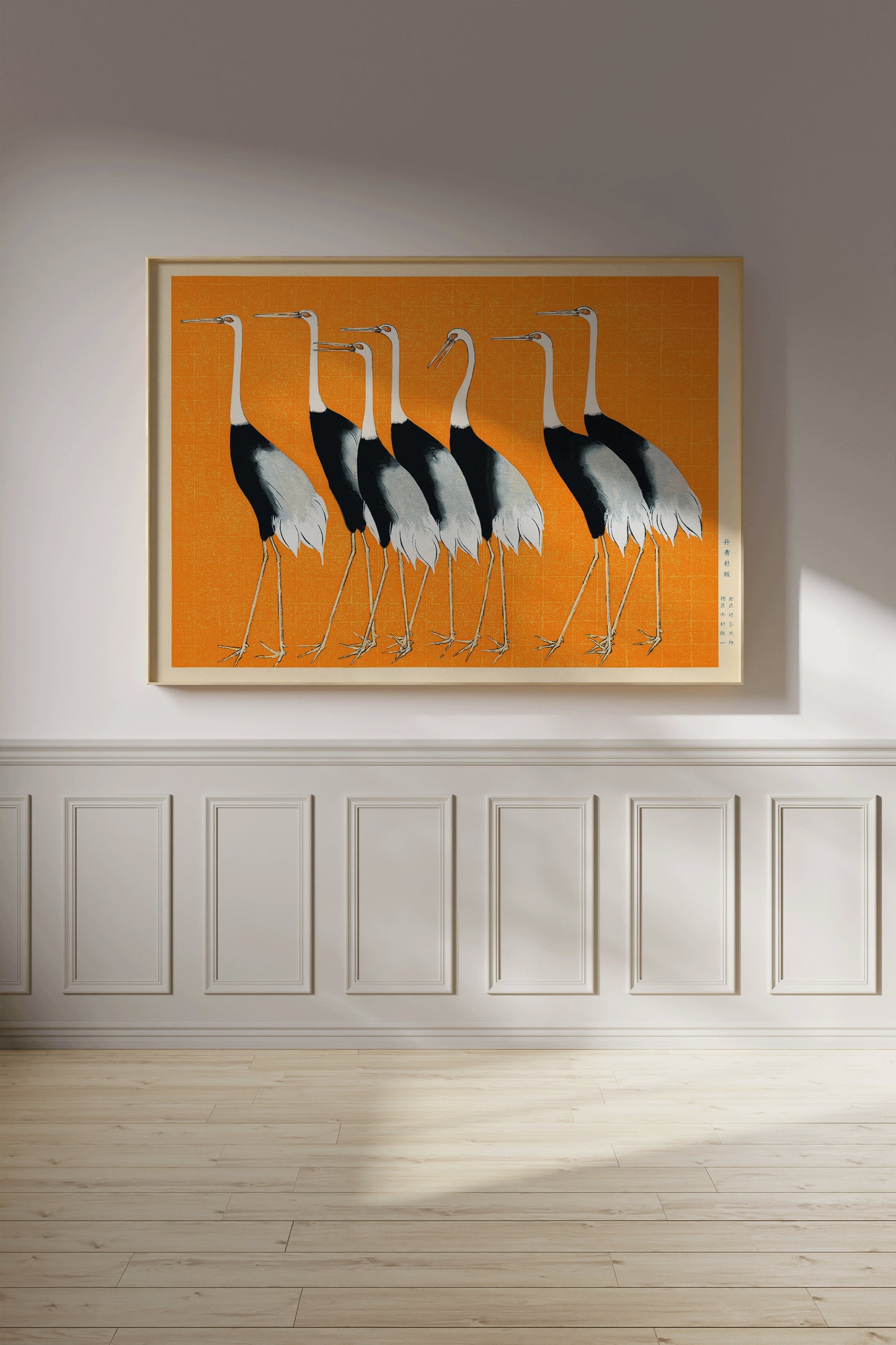 Vintage Japanese artwork of cranes in orange on wall, available framed or unframed. Museum-quality print, handcrafted frame options.