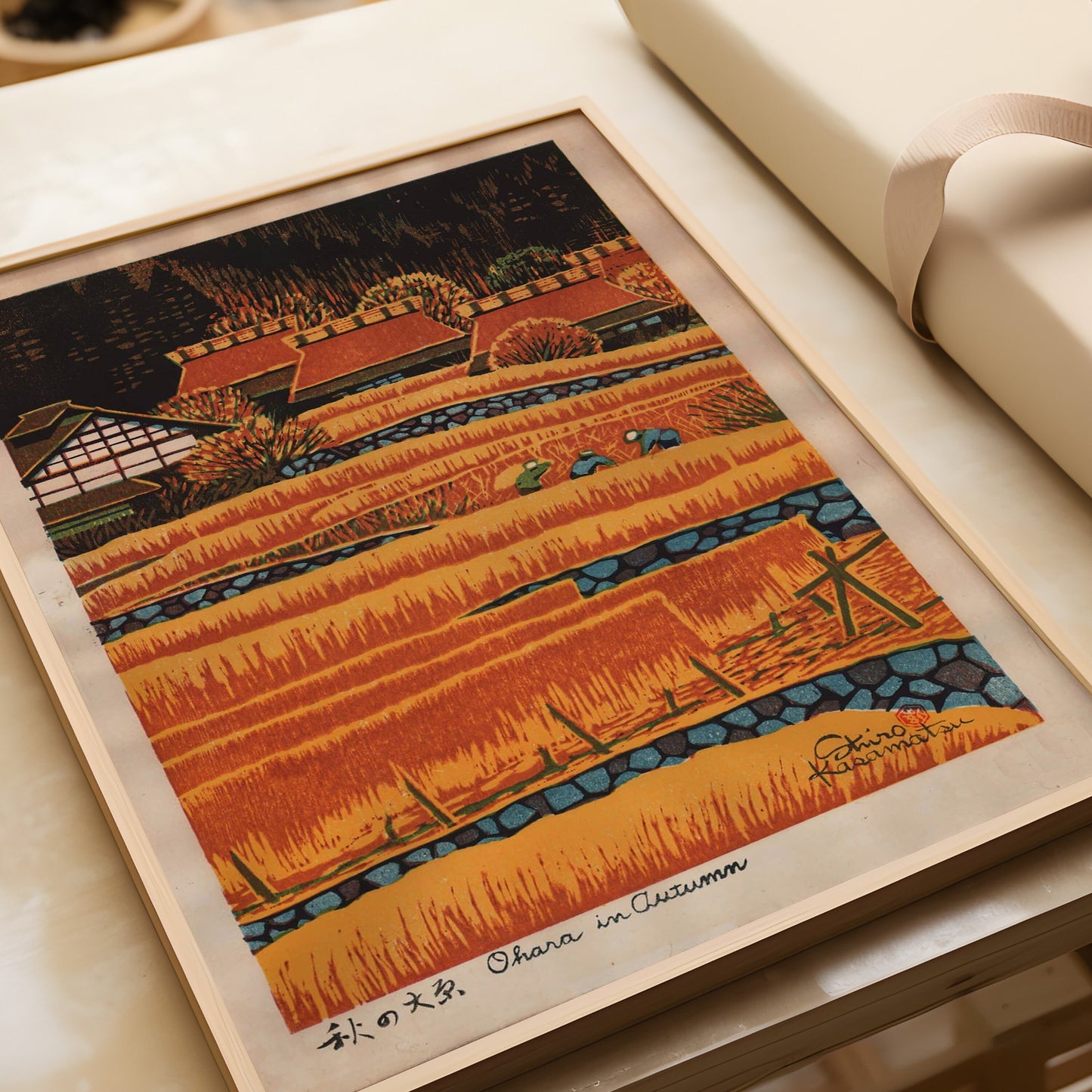 Shiro Kasamatsu's Ohara in Autumn, vintage Japanese woodblock print featuring orange hues, displayed in a natural wood frame.