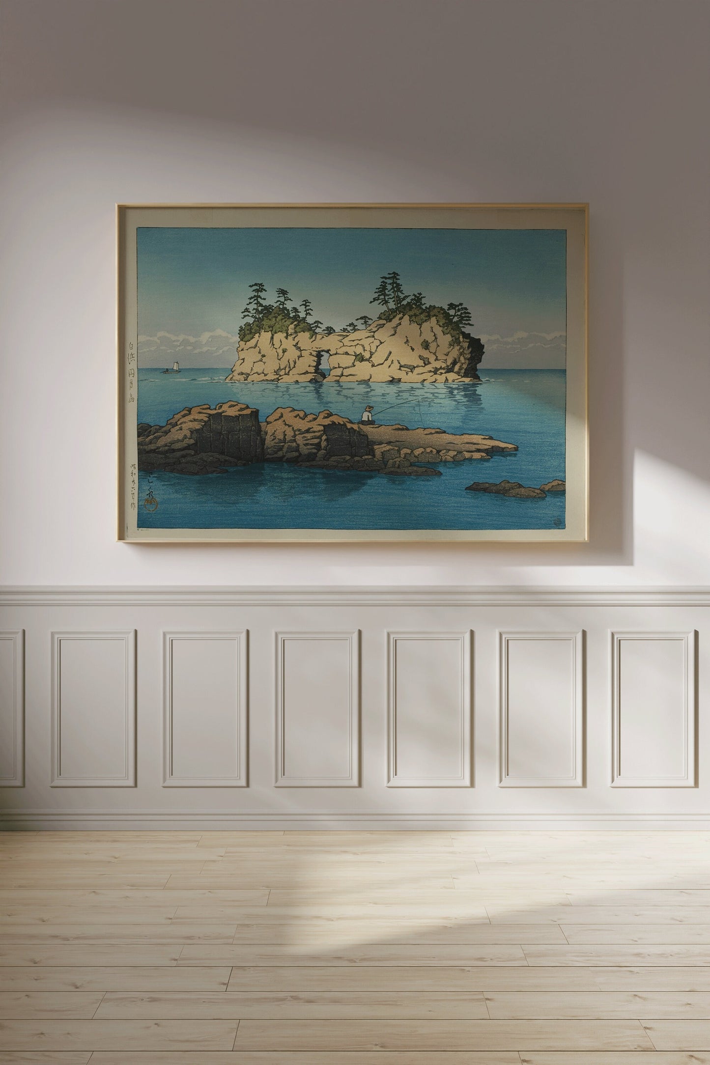 Kawase Hasui Engetsu Island vintage art print framed in a light wood frame hanging on a wall in a minimalist room.