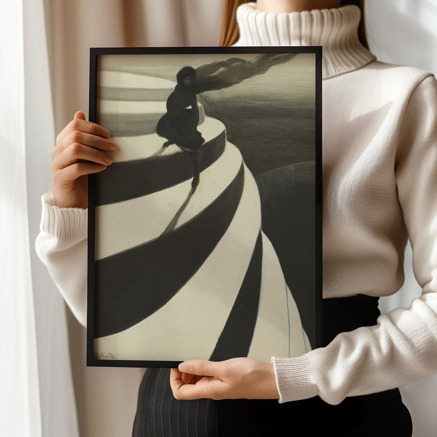 Woman holding framed Leon Spillaert black and white art print, Vertigo, showcasing museum-quality craftsmanship and artistic design.