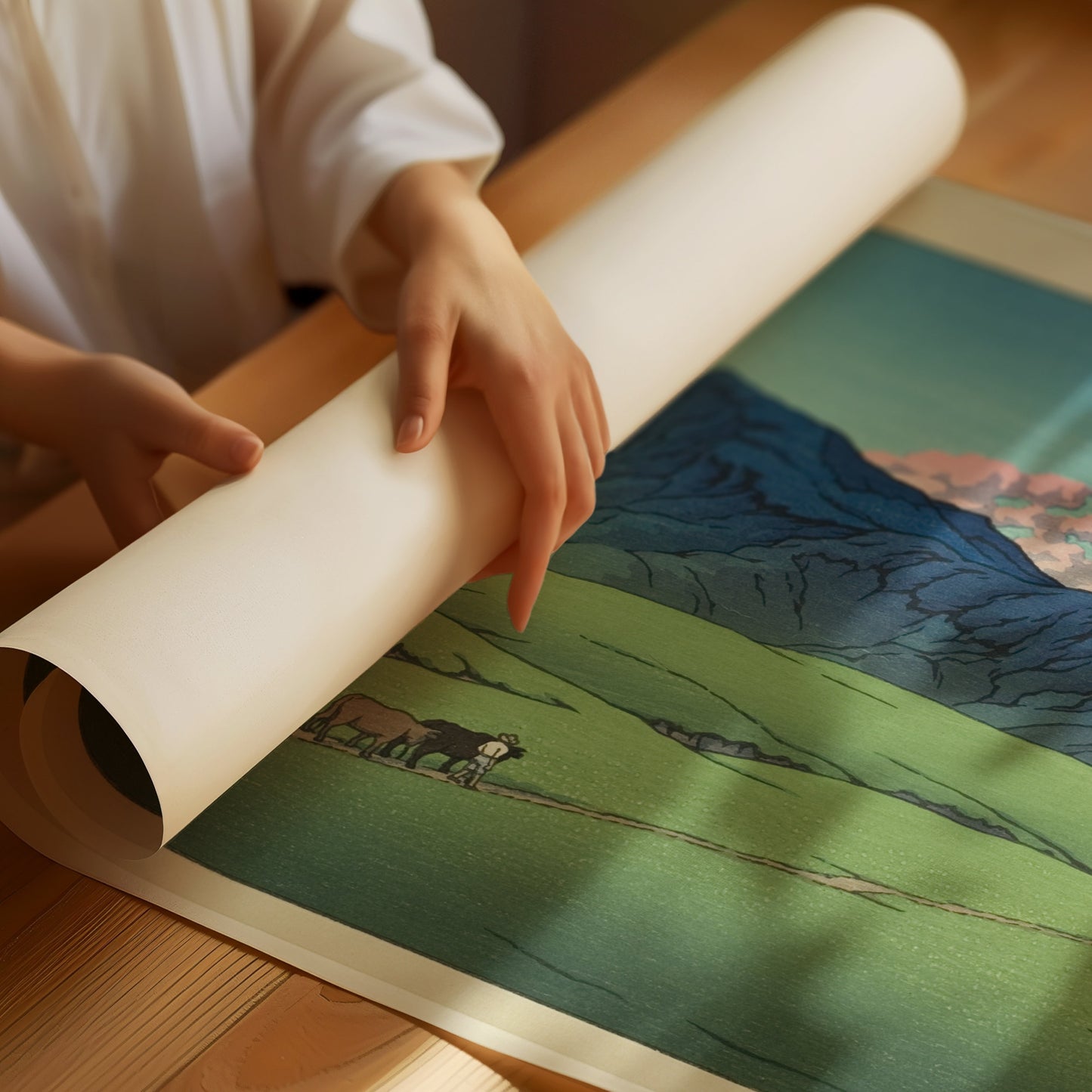 Rolling out Kawase Hasui's Dusk at Aso, Japanese vintage woodblock art, showcasing meticulous craftsmanship on high-quality paper.