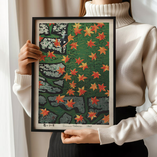 Woman holding Shiro Kasamatsu's "Moss and Maple, Strewn Colours" print, Japanese shin-hanga art, with red maple leaves.