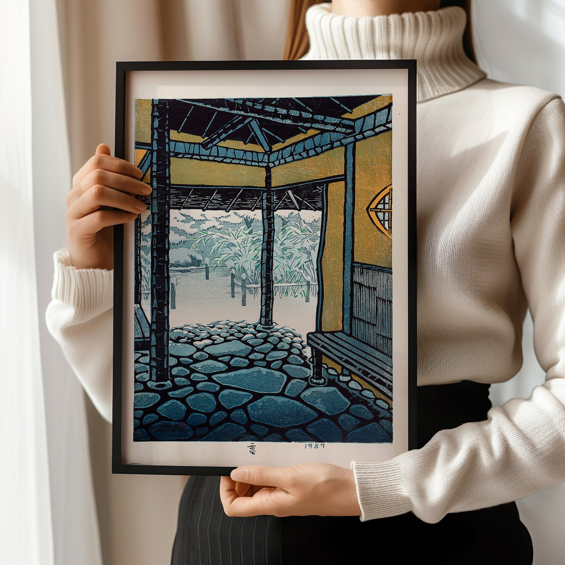 Person holding framed Snow by Shiro Kasamatsu, vintage Japanese woodblock art, available in bespoke or classic frames.