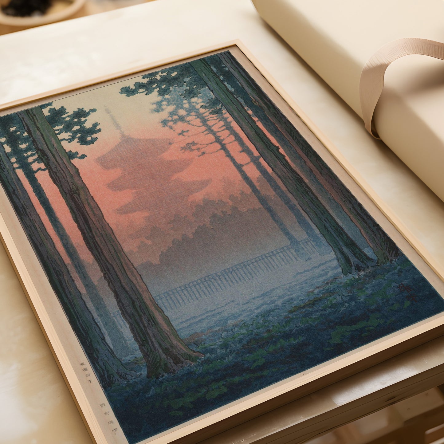 Vintage Japanese woodblock art print of a serene torii gate within a bamboo grove, available framed in handcrafted FSC-certified wood.