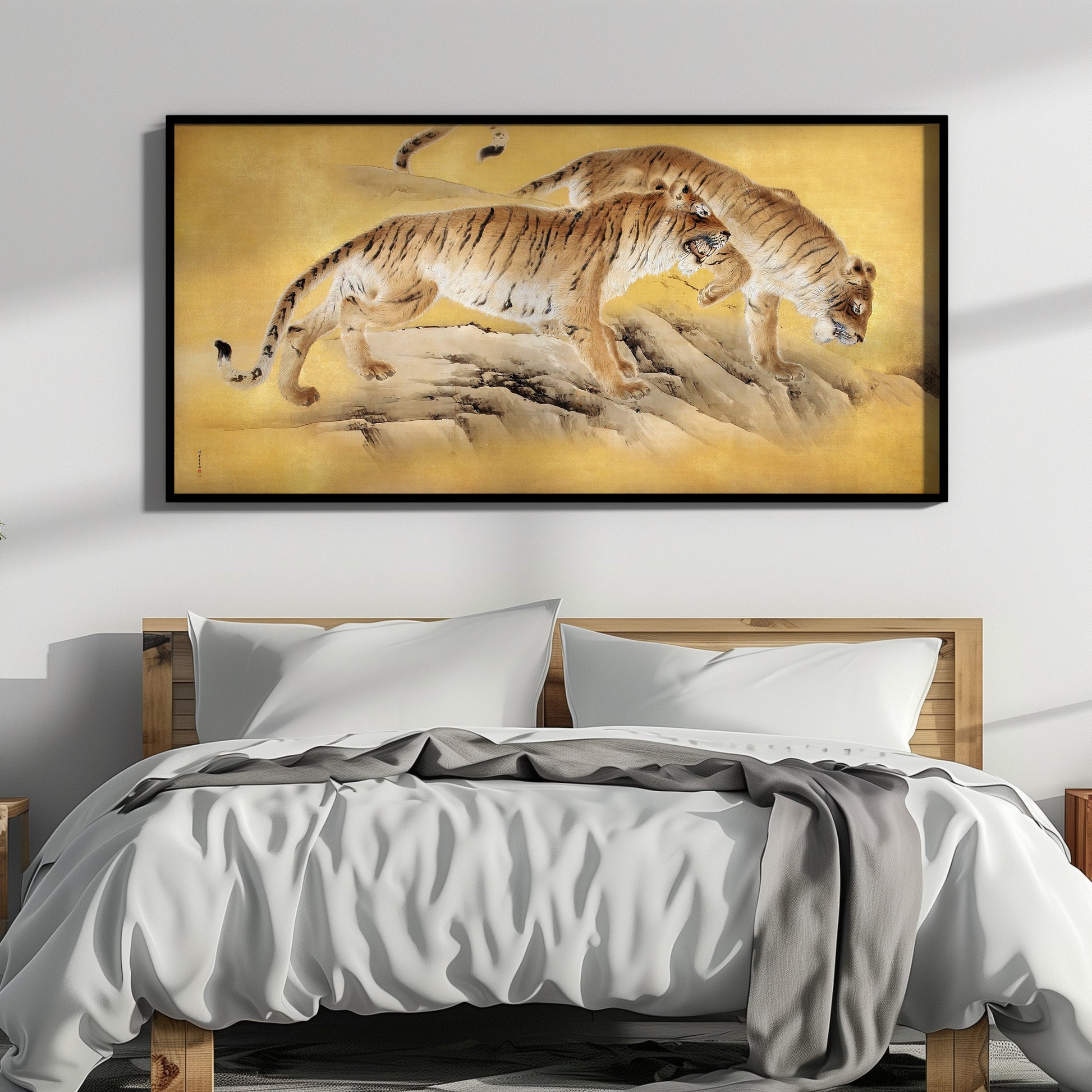 Vintage Japanese art print of tigers by a mountain stream, framed, displayed above a modern bed in a stylish bedroom.