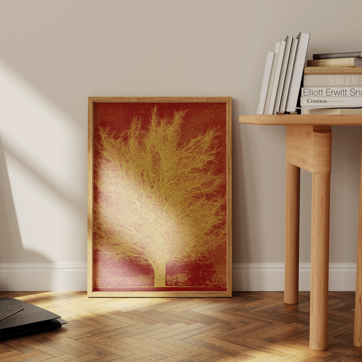 Vintage Japanese woodblock art print "Gold Tree (Remix)" in a nude oak frame leaning against a wall near a wooden table.