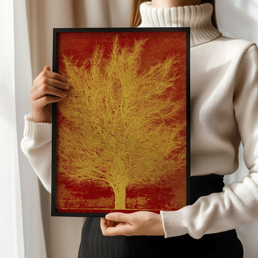 Woman holding a framed Joichi Hoshi Gold Tree print, showcasing vintage Japanese woodblock art in a modern setting.