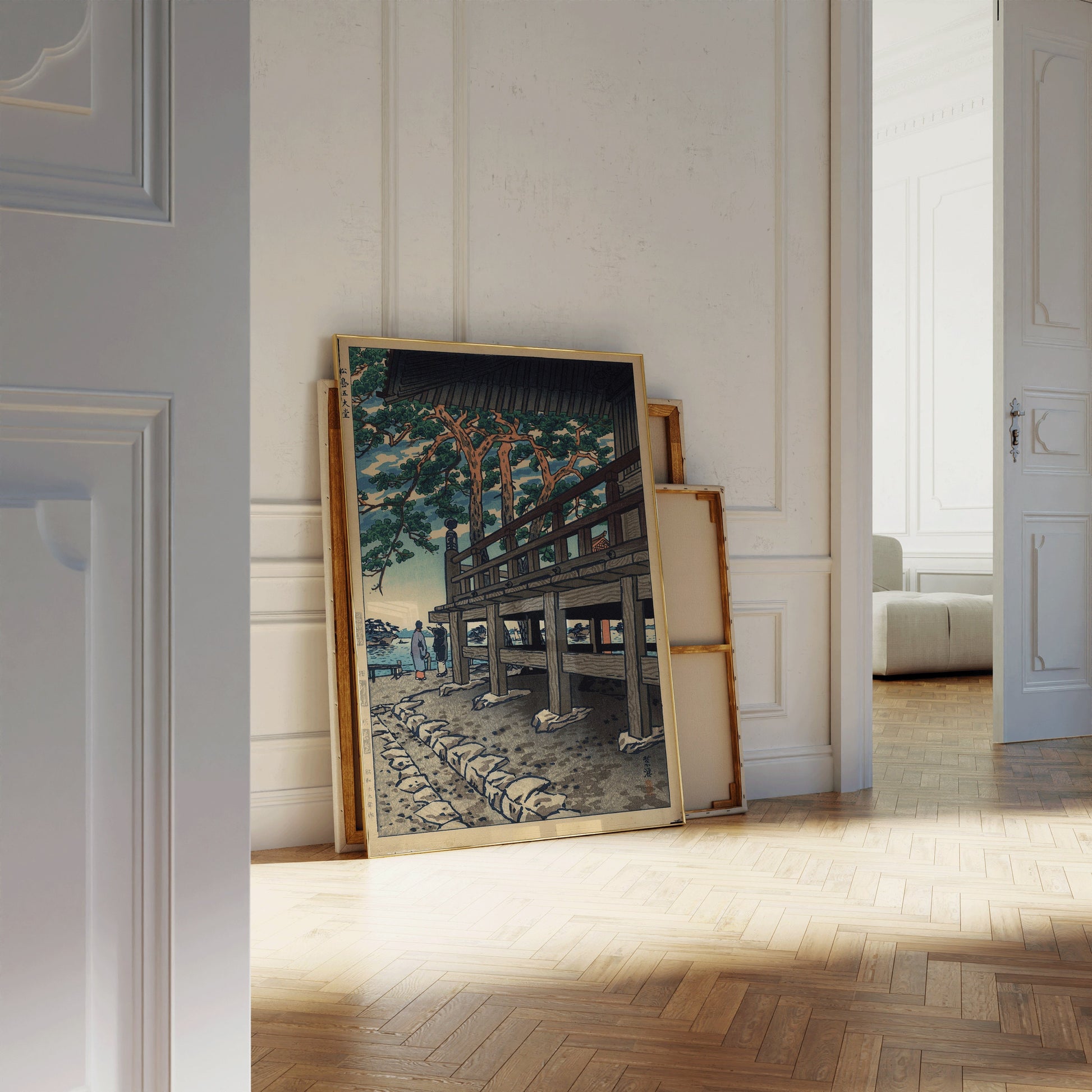 Shiro Kasamatsu's Godaido Pagoda framed print leaning against a wall in a bright room with wooden flooring.