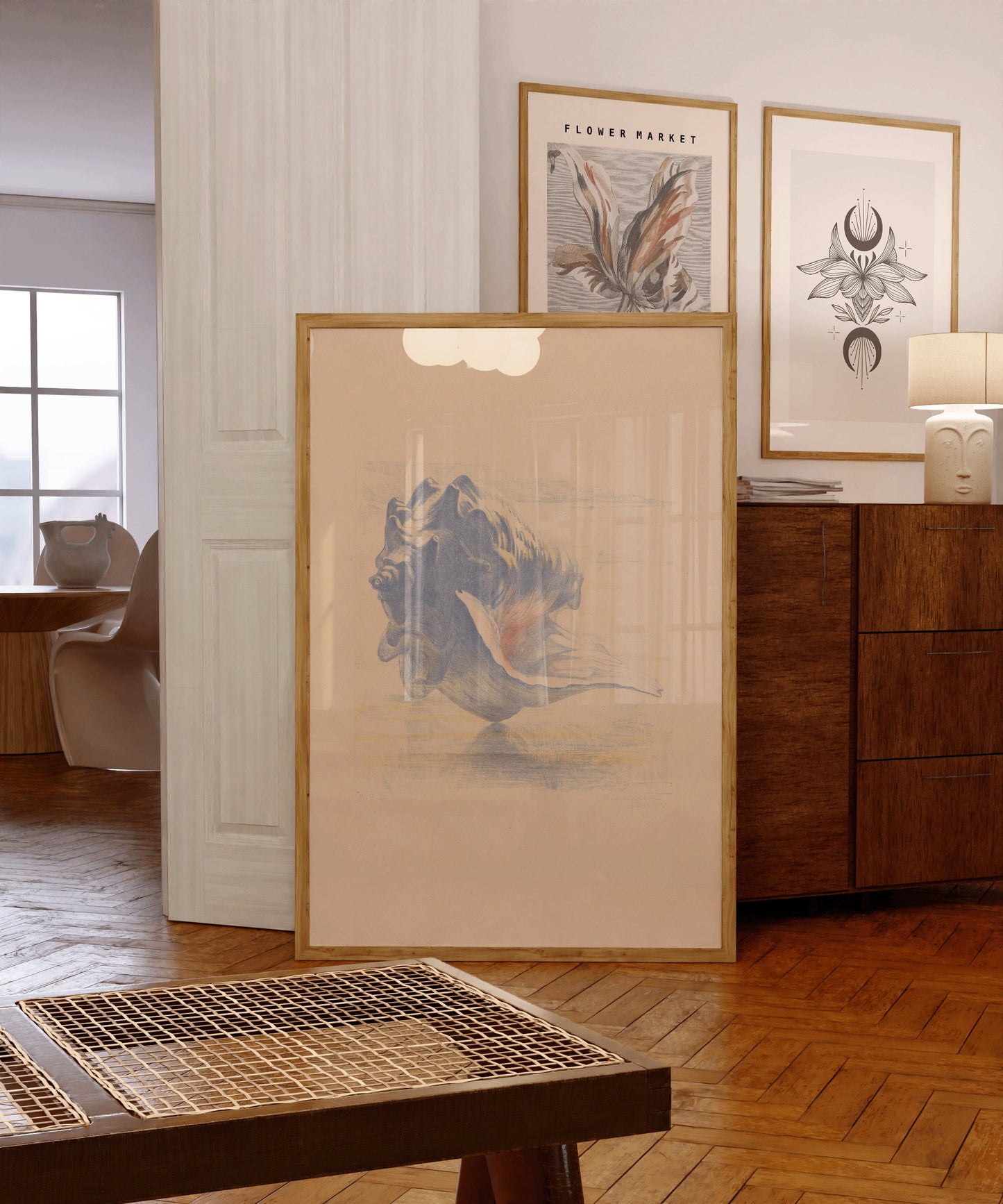 Elegant room with framed Maurits van der Valk shell sketch art in beige and blue, showcasing museum-quality decor options.