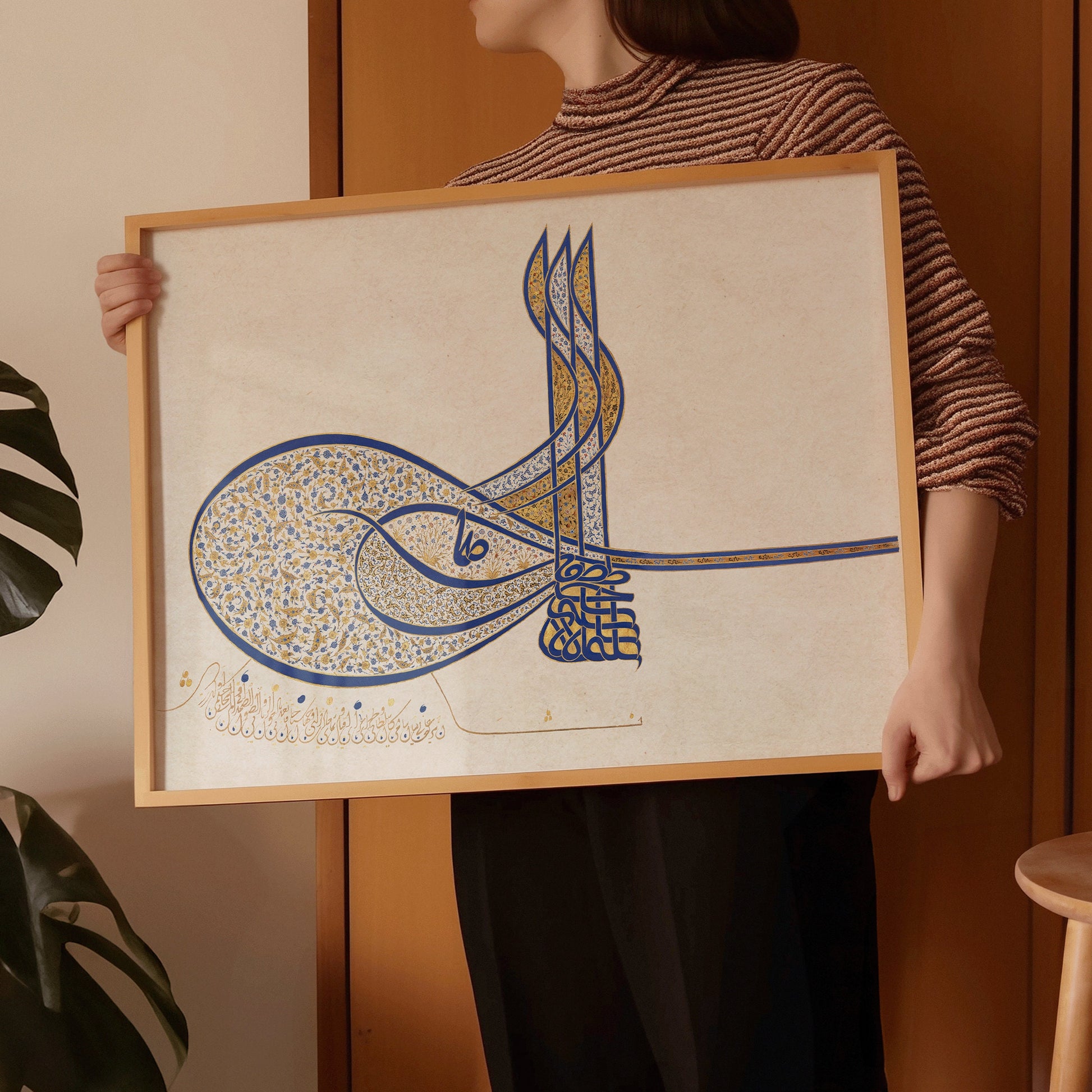 Vintage Arabic Calligraphy Art Print with Custom Wood Frame Displayed by Person