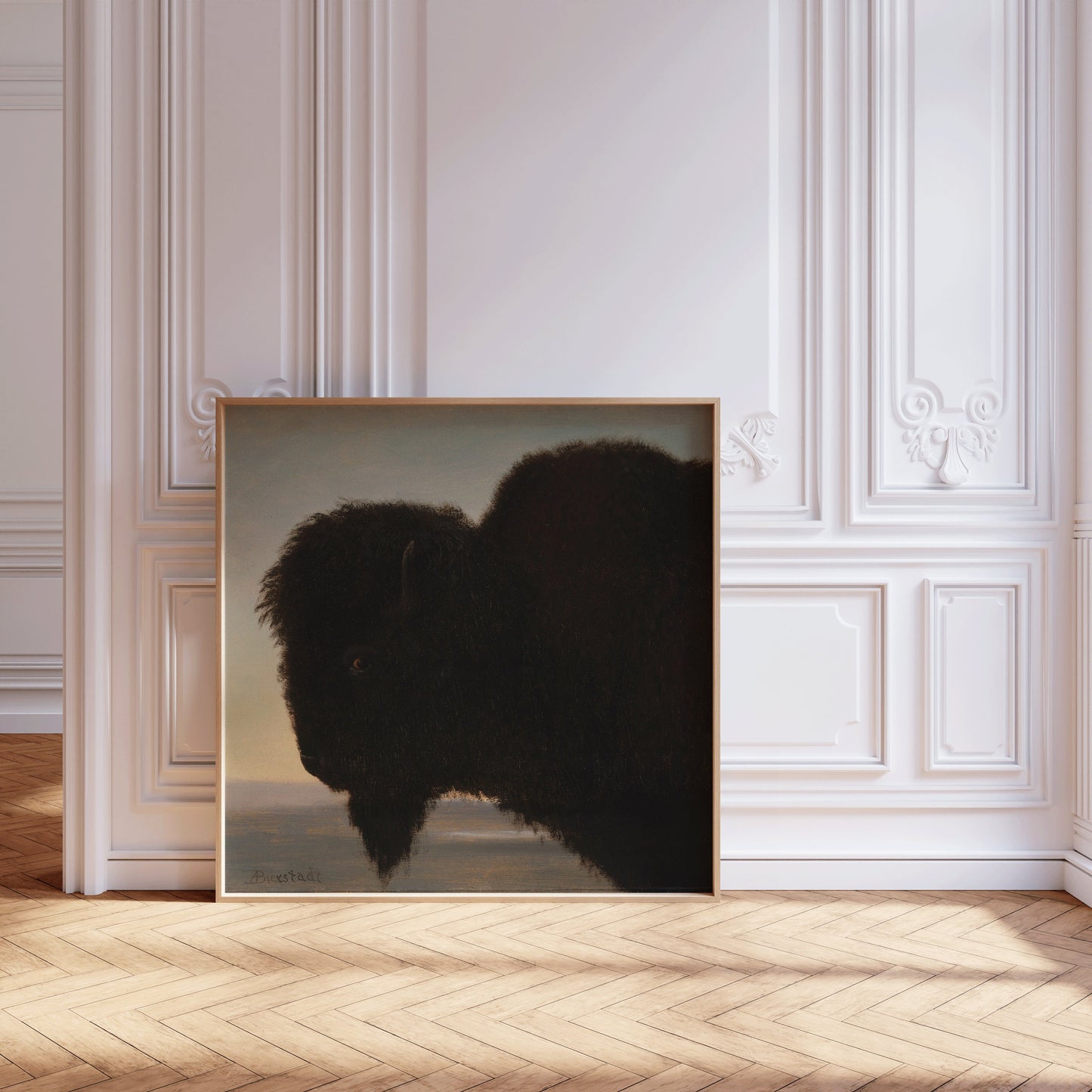 Buffalo silhouette art print in elegant room with ornate white walls and wooden floor.