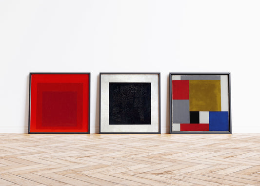 Set of 3 Bauhaus art prints by Josef Albers, Kazimir Malevich, and Theo von Doesburg, shown in bespoke frames on wooden floor.