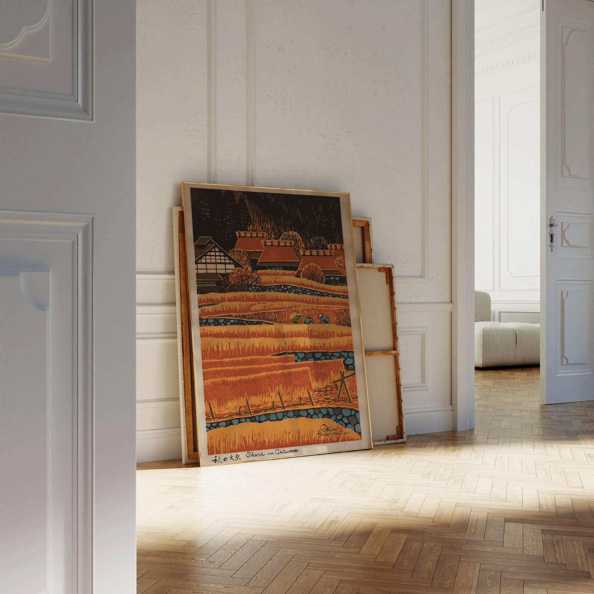 Vintage Shiro Kasamatsu woodblock print in warm orange hues, leaning against a white wall, ready for framing in an elegant interior.