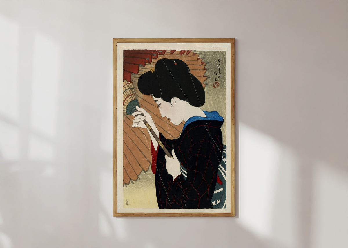 Framed art print of Passing Rain by Ito Shinsui, in a light wood frame on a sunlit white wall