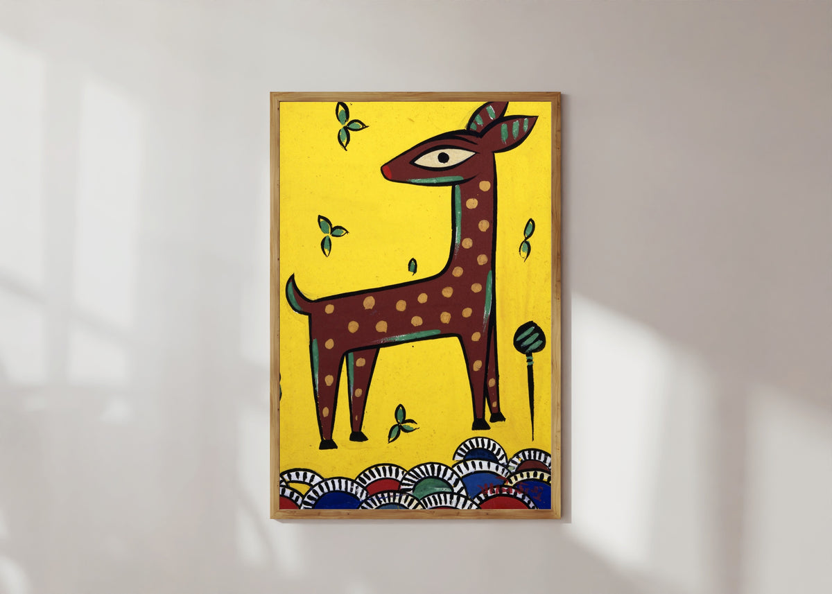 Framed art print of Fawn (Horinchhana) by Jamini Roy, in a light wood frame on a sunlit white wall