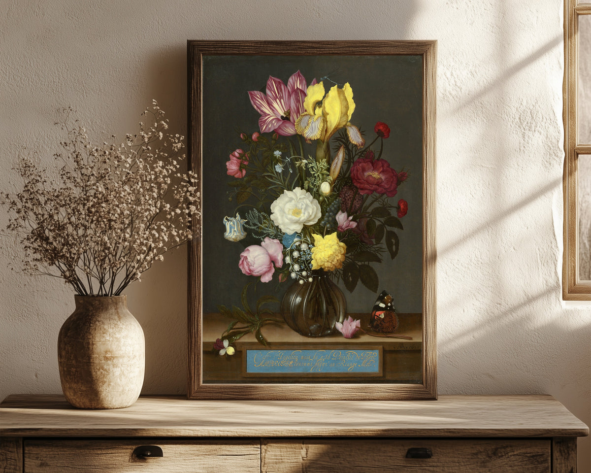 Framed art print of Bouquet of Flowers in a Glass Vase by Jan Davidsz. de Heem, in a dark wood frame leaning on a rustic console beside dried flowers