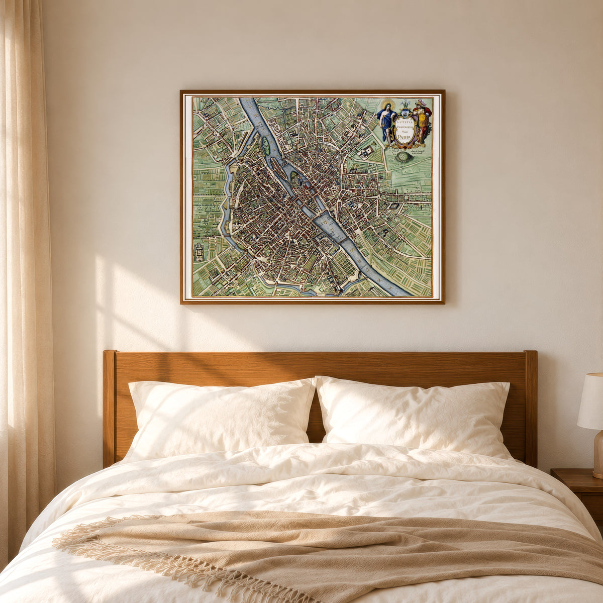Framed art print of Lutetia Parisiorum vulgo Paris by Jan Janssonius, in a slim wood frame above a bed in a sunlit bedroom