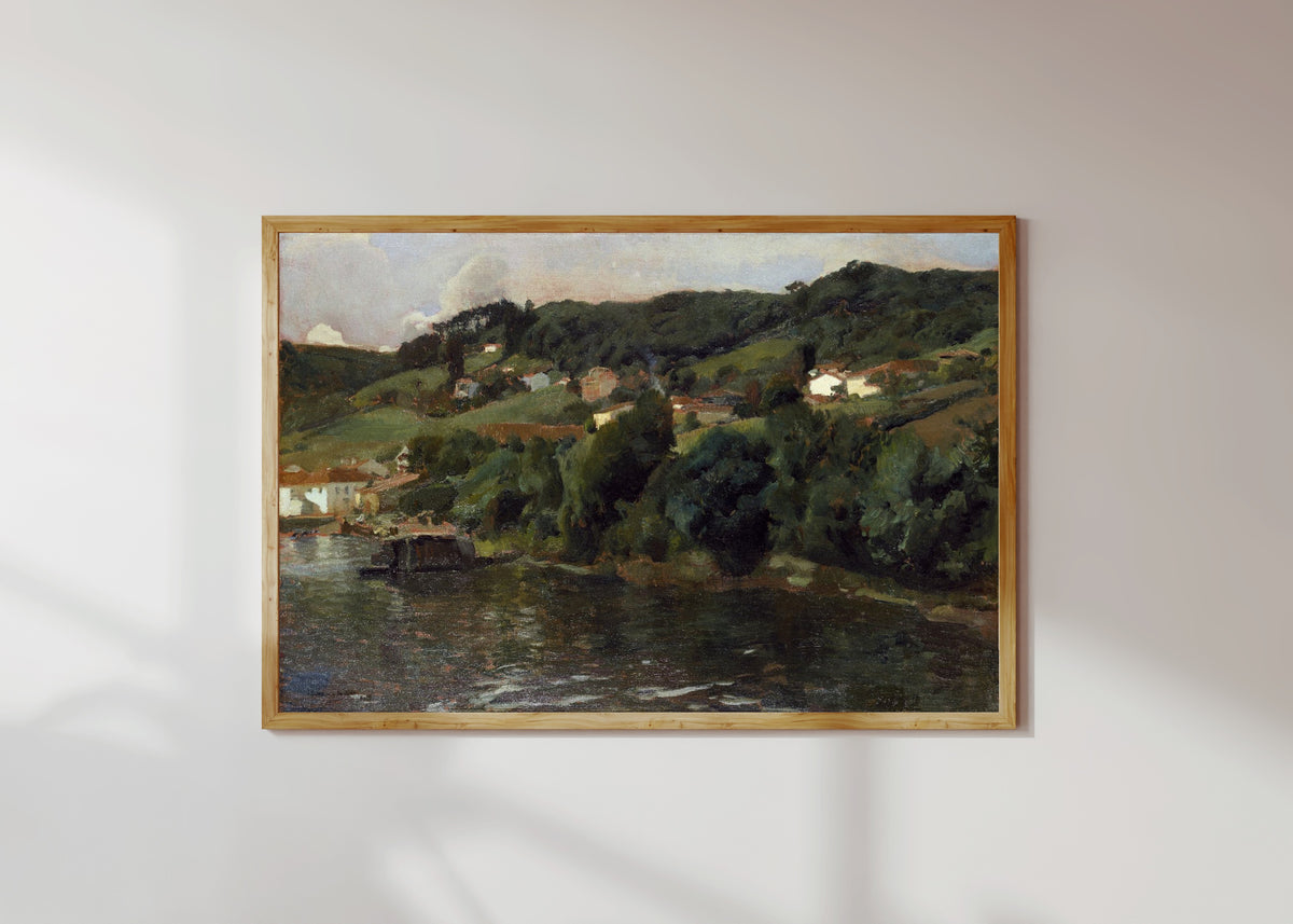 Framed art print of Asturian Landscape by Joaquín Sorolla, in a light wood frame on a sunlit white wall