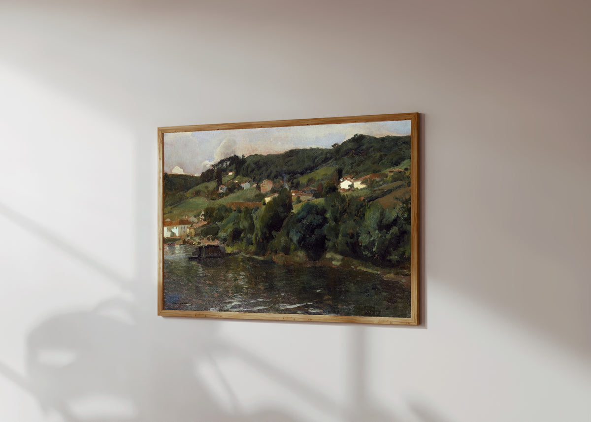 Framed art print of Asturian Landscape by Joaquín Sorolla, in a light wood frame on a sunlit white wall, seen at a slight angle